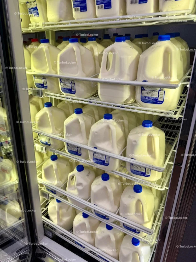 2 Percent Milk Stacked On Shelves In A Refrigerator