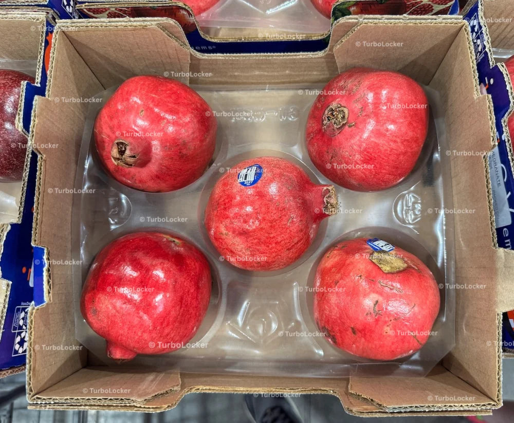 A Box Of Pomegranates On Display At A Warehouse Store