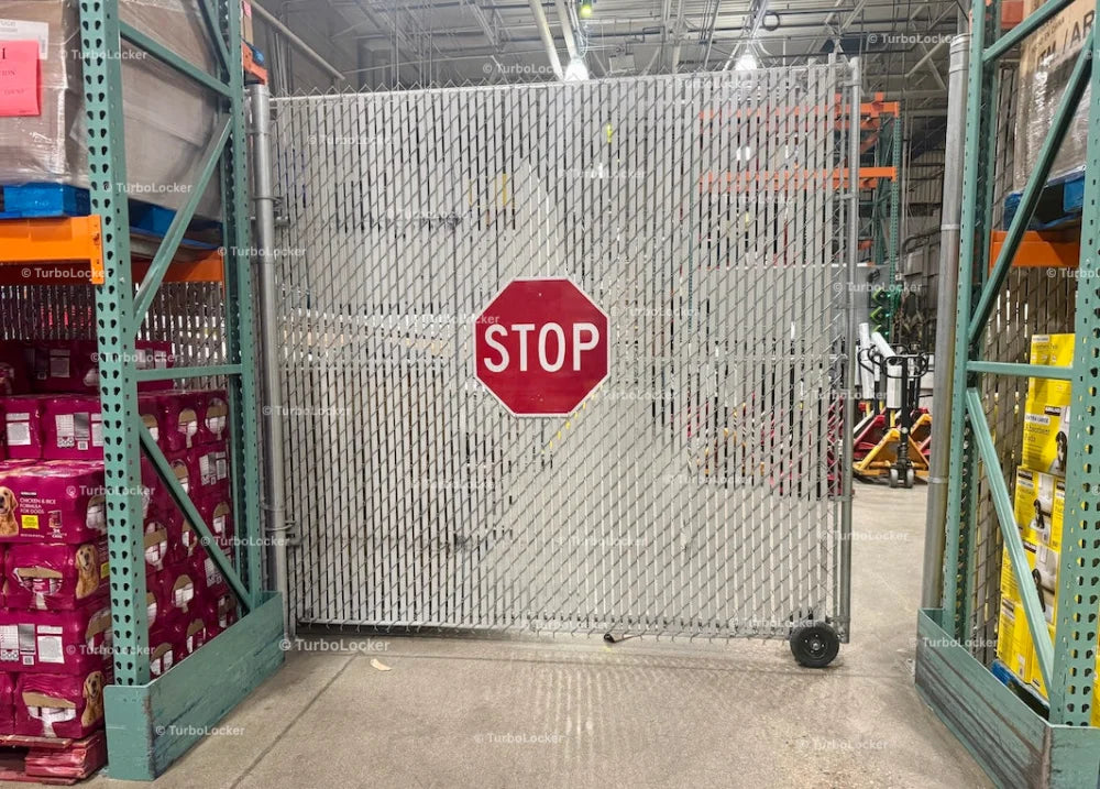 A Gate With A Stop Sign At A Warehouse Store