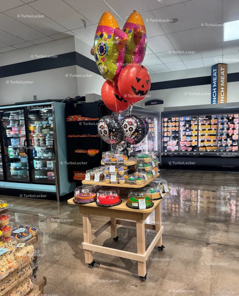 A Halloween Themed Bakery Display With A Variety Of Cakes