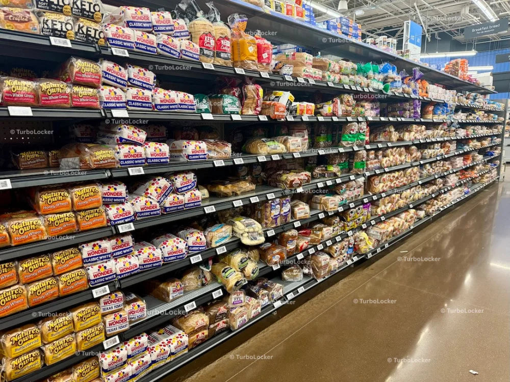 Bread Bagels And Muffins On Shelving At A Grocery Store