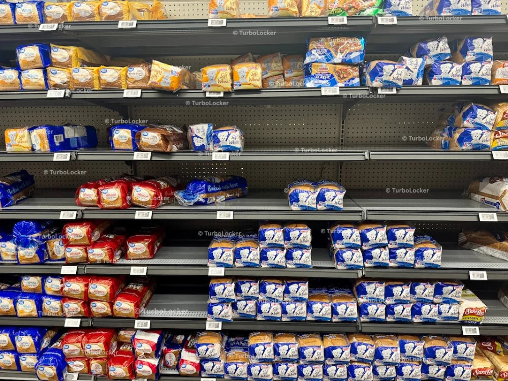 Bread Loafs On Shelving At A Grocery Store