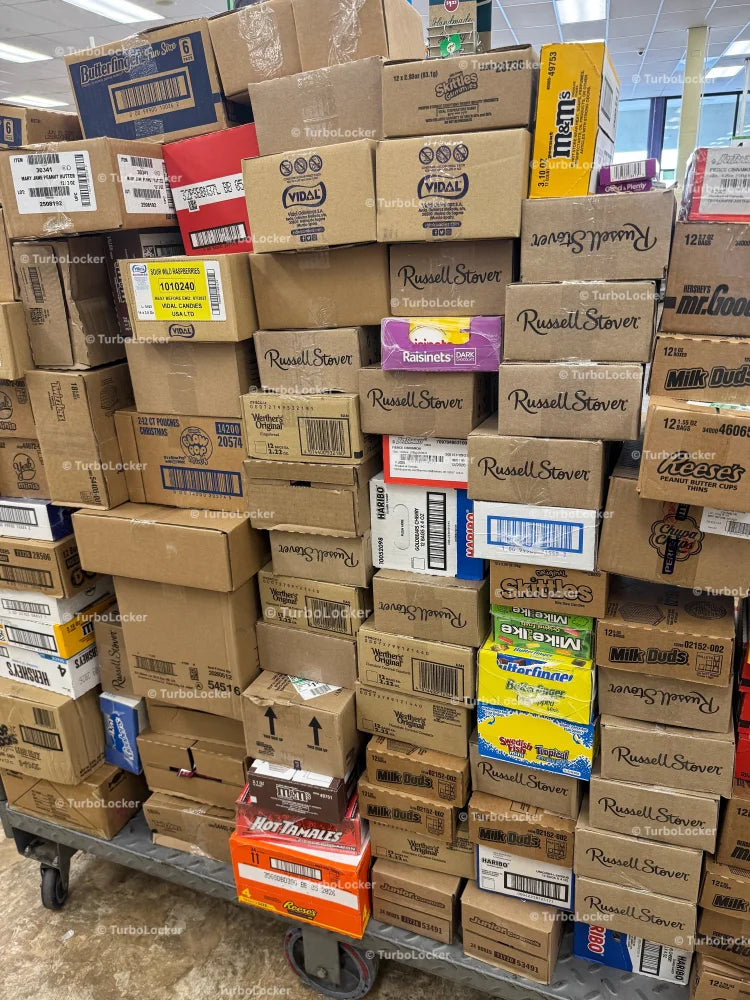 Chocolate And Candy Stacked On A Store Cart Ready For Stocking Shelves