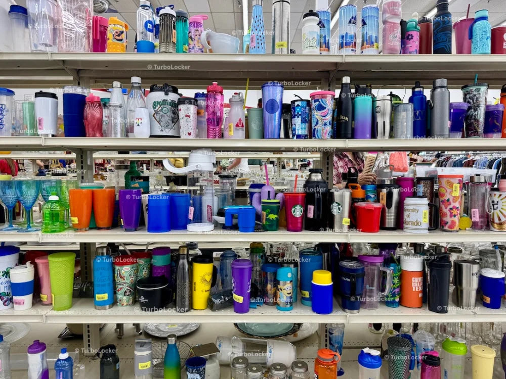 Cups And Tumblers Lined On A Shelf At A Thrift Store