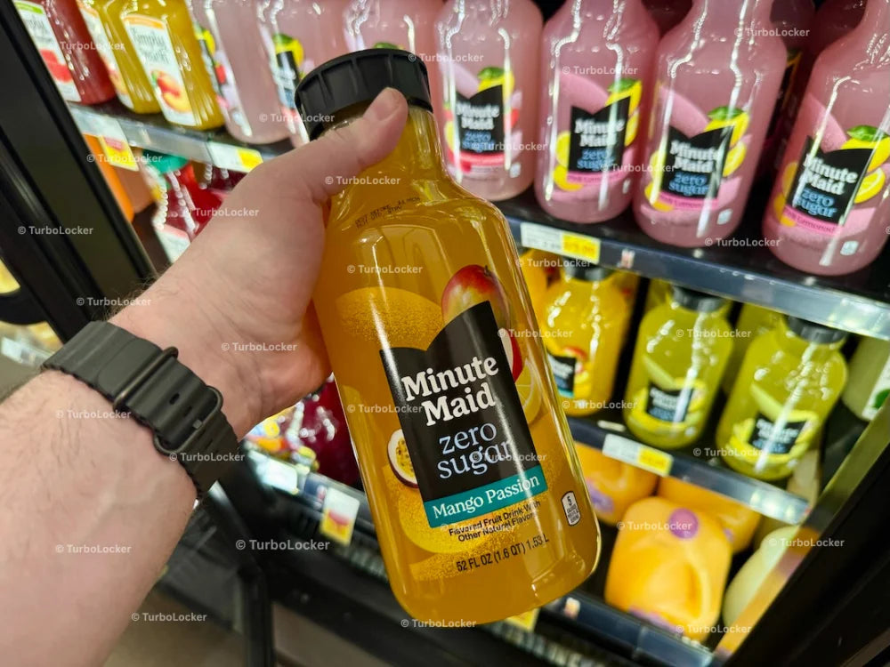 A Hand Holding Minute Maid Mango Passion