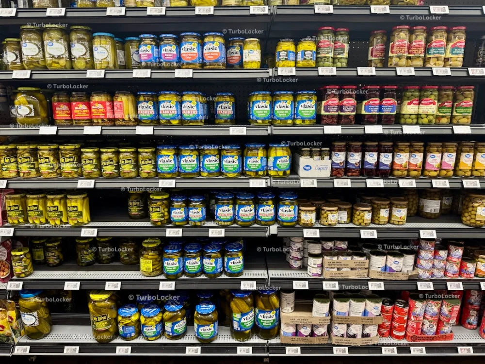 Pickles And Olives On Shelves At A Grocery Store