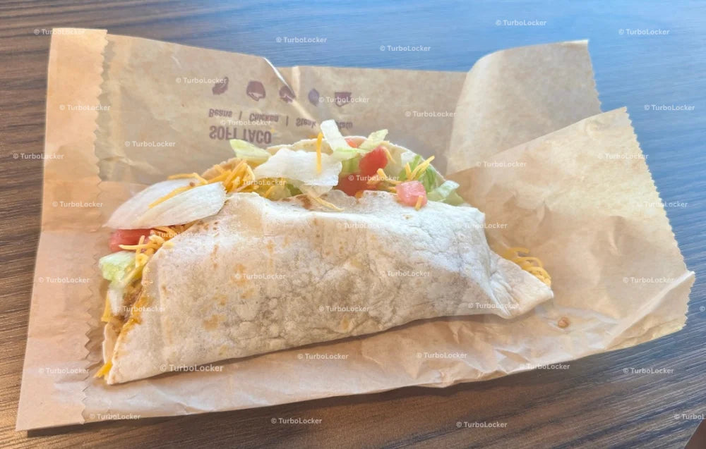 Taco Bell Beef Soft Taco Supreme On a Table With Bag